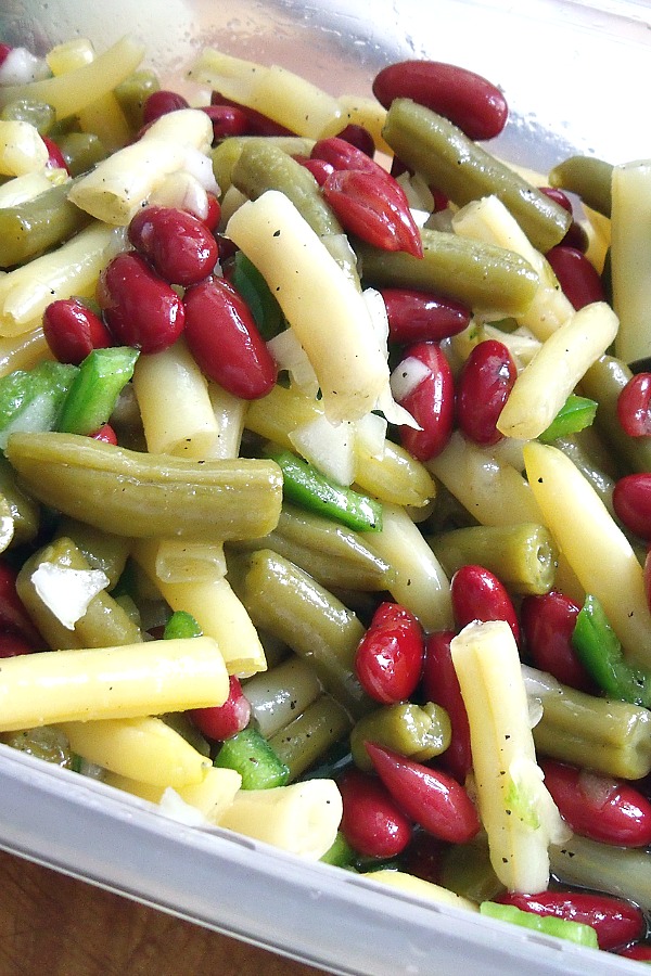 Easy recipe for three bean salad combines green and waxed beans, kidney beans, onion and bell pepper tossed in a sweetened vinaigrette. Great side dish for burgers and hotdogs, barbecued chicken and pork. Serve at your next cookout! 