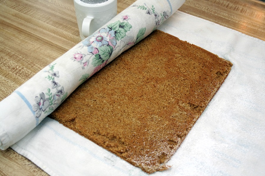 Famous and ever popular Pumpkin Roll. Sweet pumpkin cake with a rich cream cheese filling is a traditional Thanksgiving favorite on the dessert table.