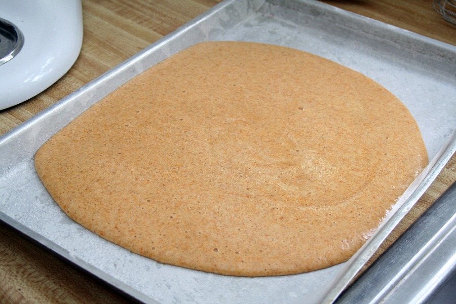 Famous and ever popular Pumpkin Roll. Sweet pumpkin cake with a rich cream cheese filling is a traditional Thanksgiving favorite on the dessert table.