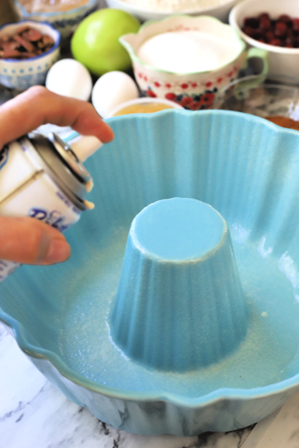 Preparing pan for all the flavors Thanksgiving Bundt cake