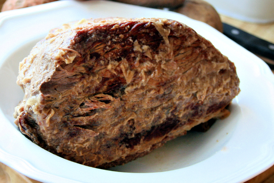 Easy, step-by-step recipe for old fashioned beef rump roast. Simmered slowly on the stovetop with carrots and potatoes until tender, it is a perfect family Sunday dinner.