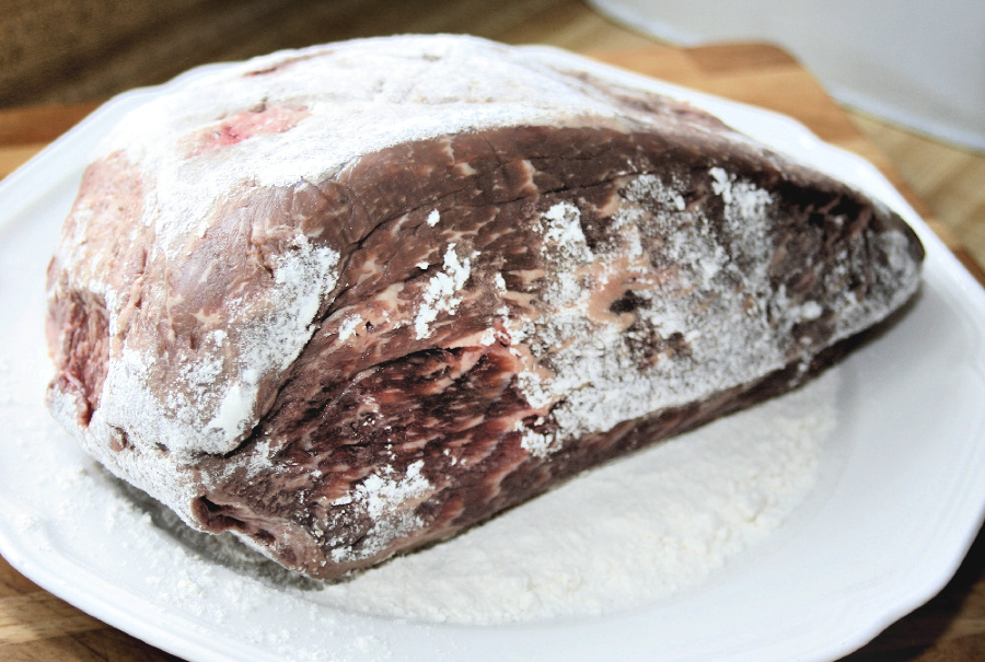 Easy, step-by-step recipe for old fashioned beef rump roast. Simmered slowly on the stovetop with carrots and potatoes until tender, it is a perfect family Sunday dinner.