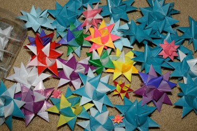 Tutorial for dipping folded paper German Stars in wax to preserve and protect from outdoor elements.