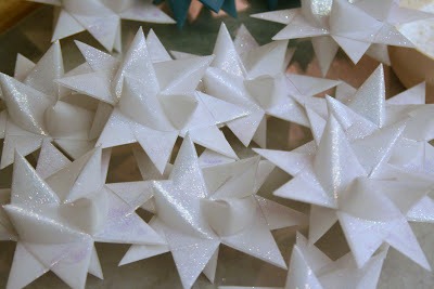 Tutorial for dipping folded paper German Stars in wax to preserve and protect from outdoor elements.