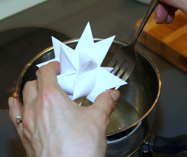 Tutorial for dipping folded paper German Stars in wax to preserve and protect from outdoor elements.