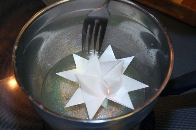 Tutorial for dipping folded paper German Stars in wax to preserve and protect from outdoor elements.