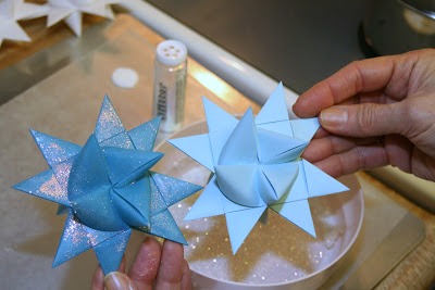 Tutorial for dipping folded paper German Stars in wax to preserve and protect from outdoor elements.