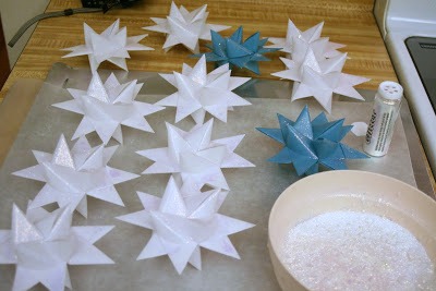 Tutorial for dipping folded paper German Stars in wax to preserve and protect from outdoor elements.