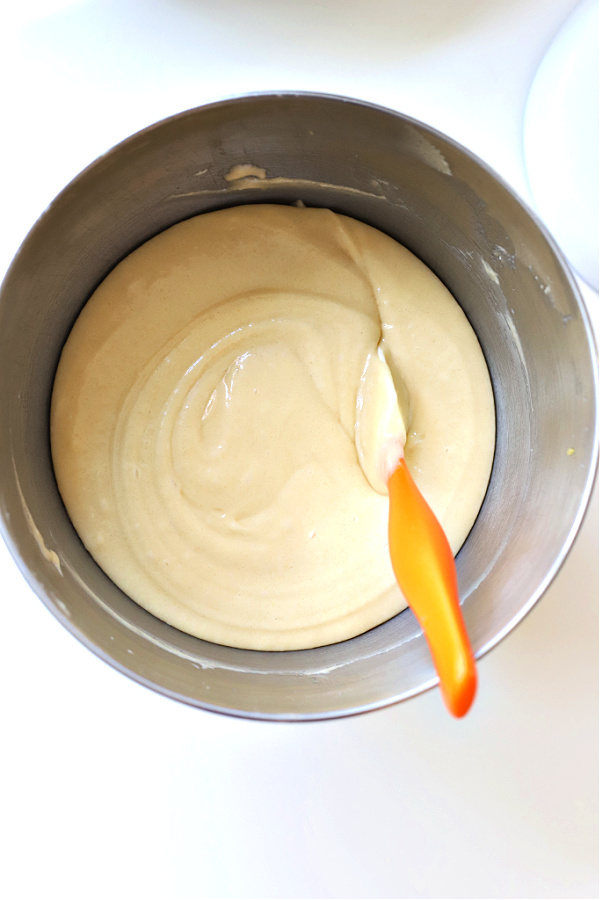 Stirring ingredients for Jewish apple cake