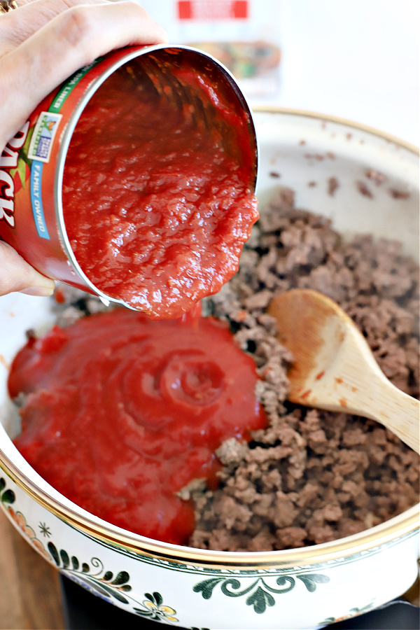 Add canned tomatoes to the hamburger barley vegetable soup.