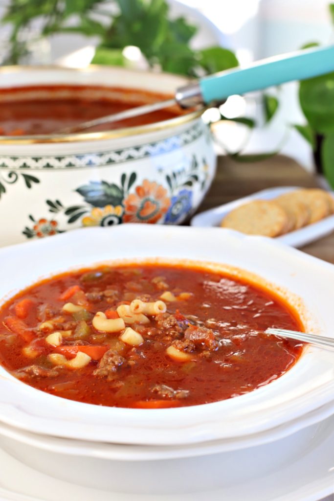 A bowl of hot homemade hamburger barley vegetable soup.