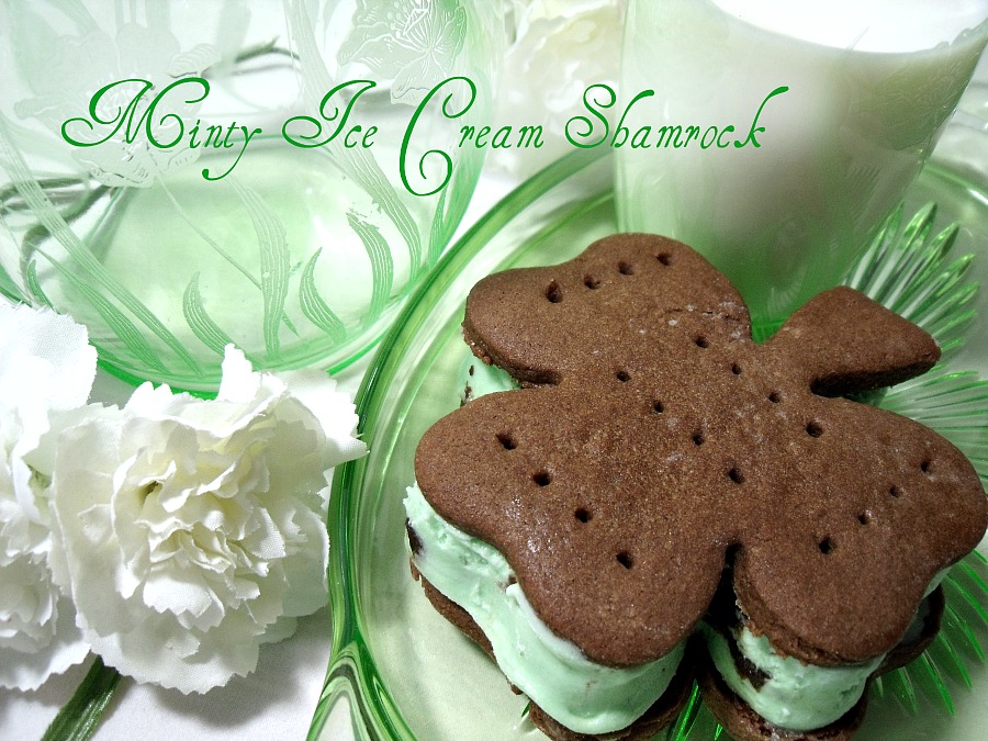 Easy recipe for homemade chocolate cookies cut into shamrock shapes with a cookie cutter. Spread with mint chocolate chip ice cream to create festive St Patrick's Day Minty Ice Cream Shamrocks treats.