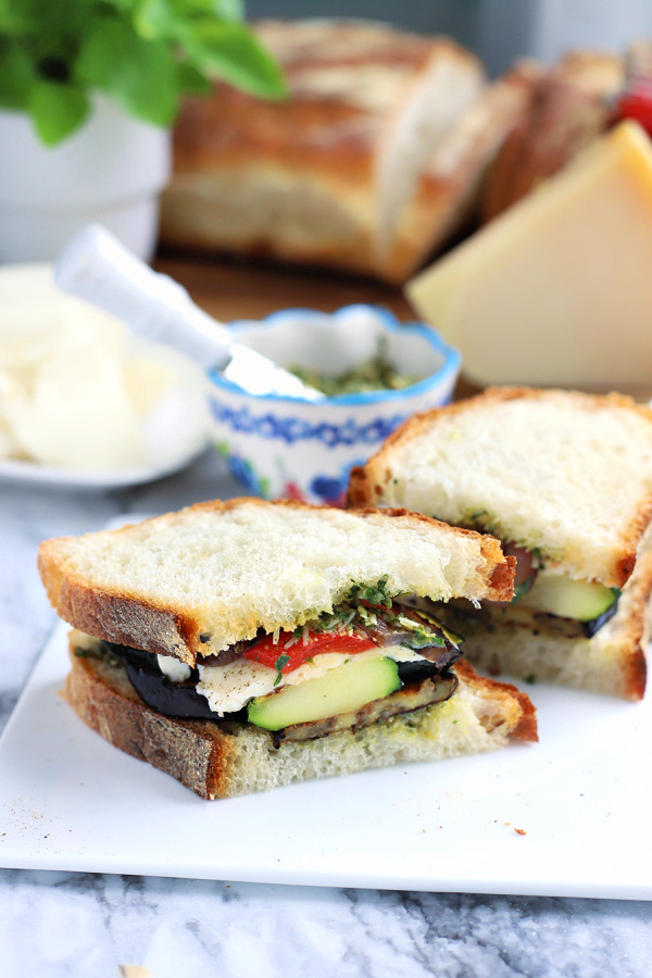 making a grilled eggplant zucchini vegetable panini sandwich