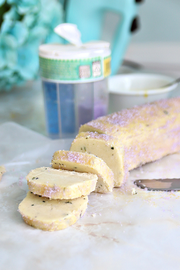 Slicing the refrigerated lavender shortbread dough log for French Sables cookies.