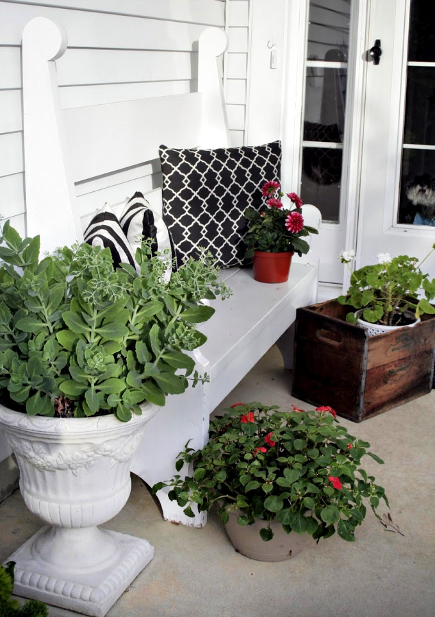 Handmade wooden bench from a vintage Southern Living pattern has found a home in the kitchen, on the front porch and on the patio.