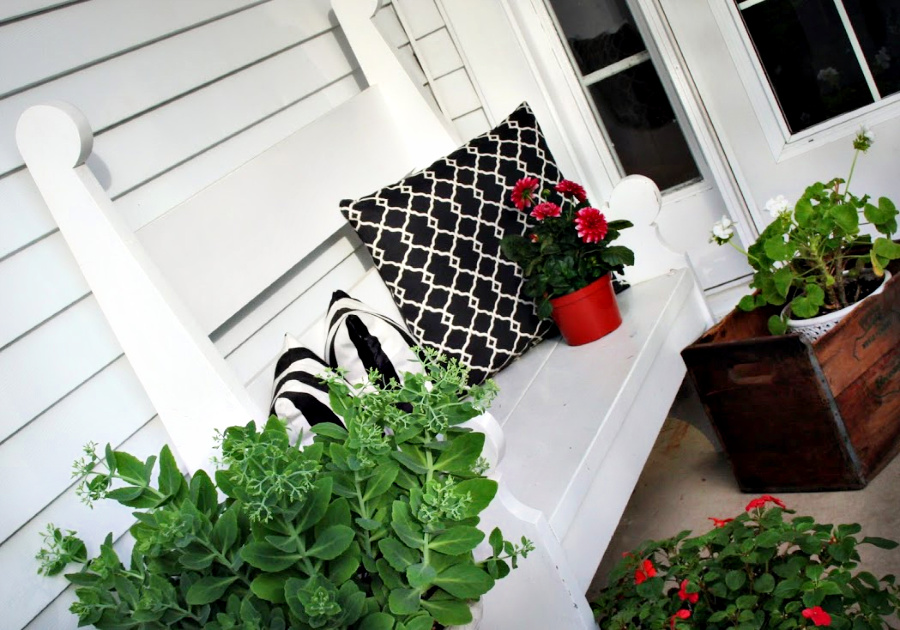 Handmade wooden bench from a vintage Southern Living pattern has found a home in the kitchen, on the front porch and on the patio.