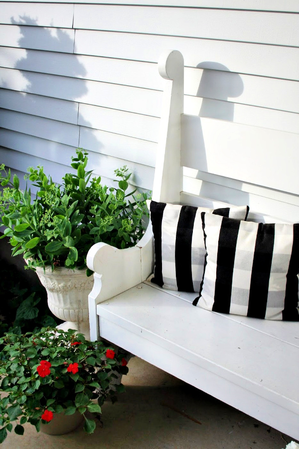 Handmade wooden bench from a vintage Southern Living pattern has found a home in the kitchen, on the front porch and on the patio.