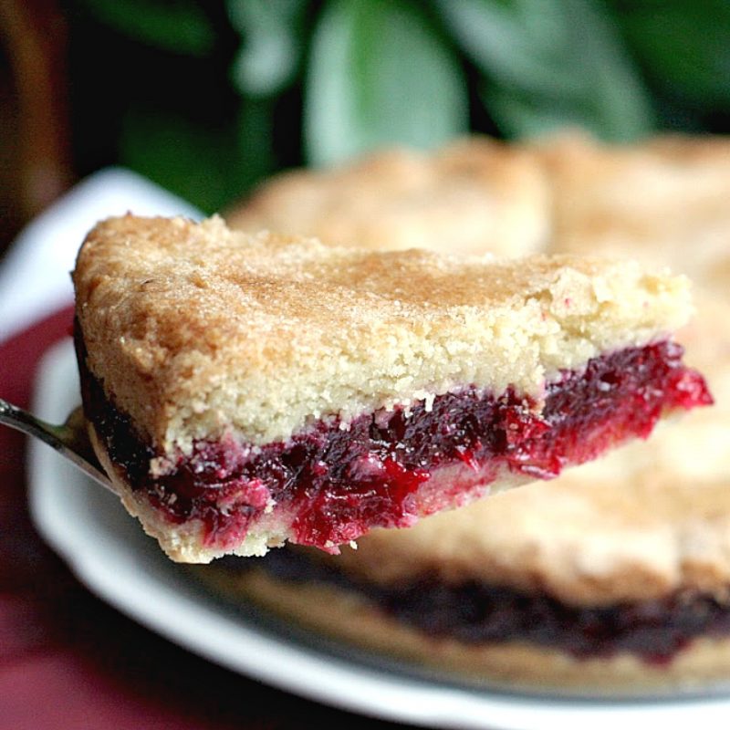 Try something new for Thanksgiving. Cranberry shortbread dessert has a sweet and tart filling between two layers of shortbread cake. A lovely addition to the dessert table.