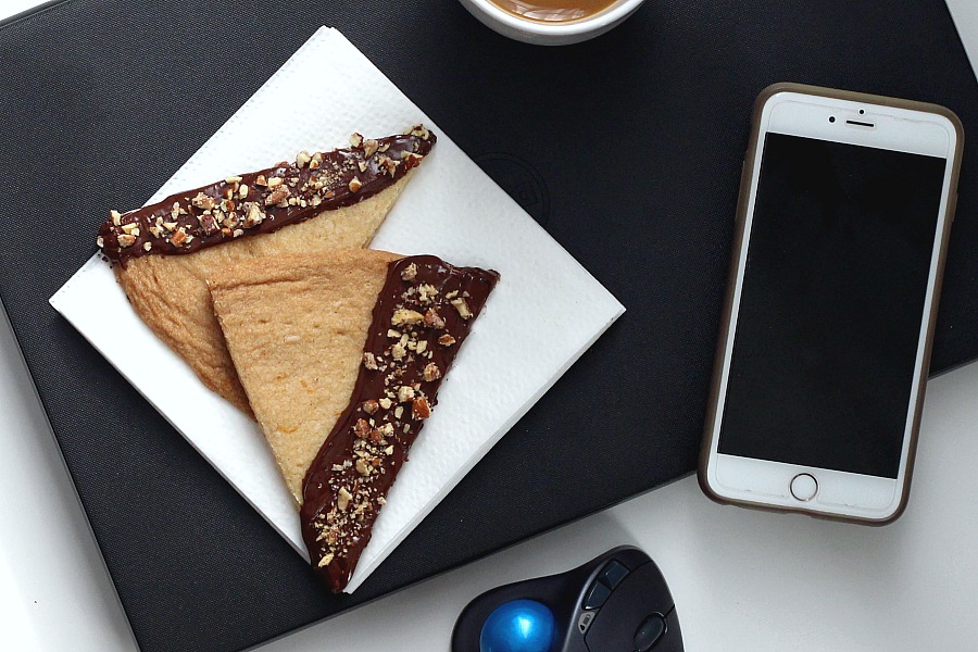 Easy recipe for chocolate dipped, orange spice shortbread. Delicious and beautiful with or without sprinkled nuts to enjoy with coffee or tea. Lovely addition to the holiday cookie tray and wonderful as homemade gift from the kitchen.