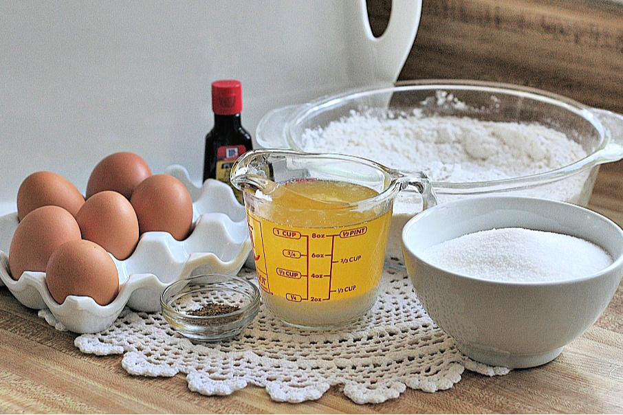 Easy recipe for crisp Italian pizzelles with anise seed made with a pizzelle maker. Perfect for your Christmas cookie tray or dessert table.