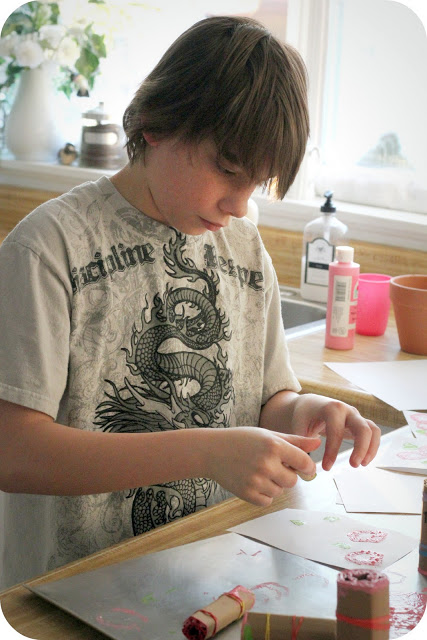 Stamped Valentine's to make with Kids is a fun and easy project. Rolled cardboard is used to create a rose pattern to stamp a lovely design to give to Mom.