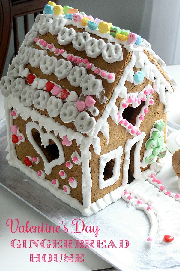 Super sweet Valentine's Day Gingerbread House is magical. Decorate with Royal Icing as the glue for favorite candy and treats. Great kids project.