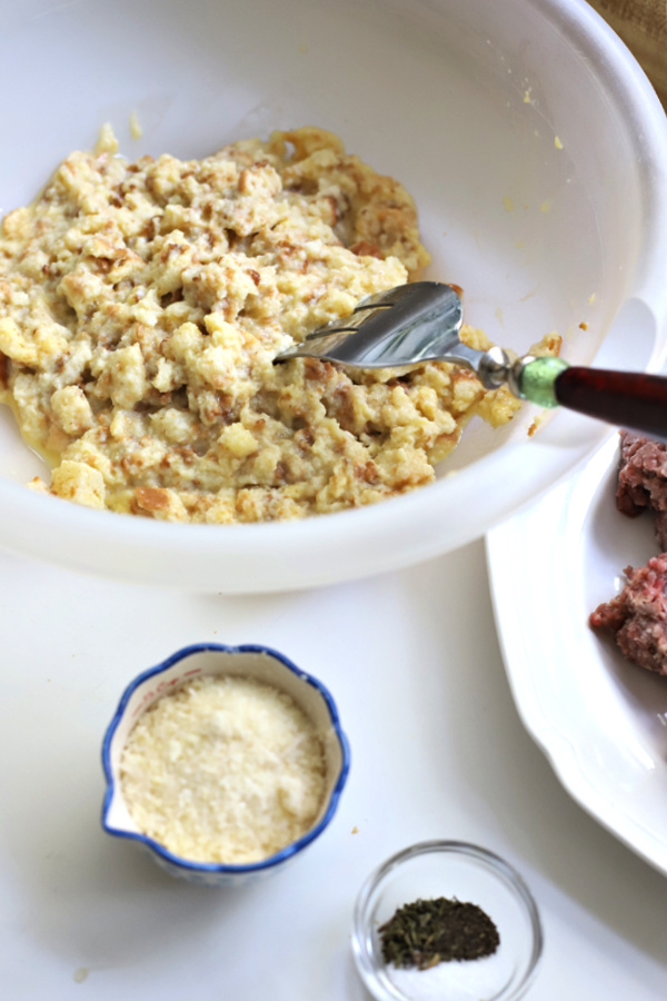 Adding eggs to the bread for favorite meatballs