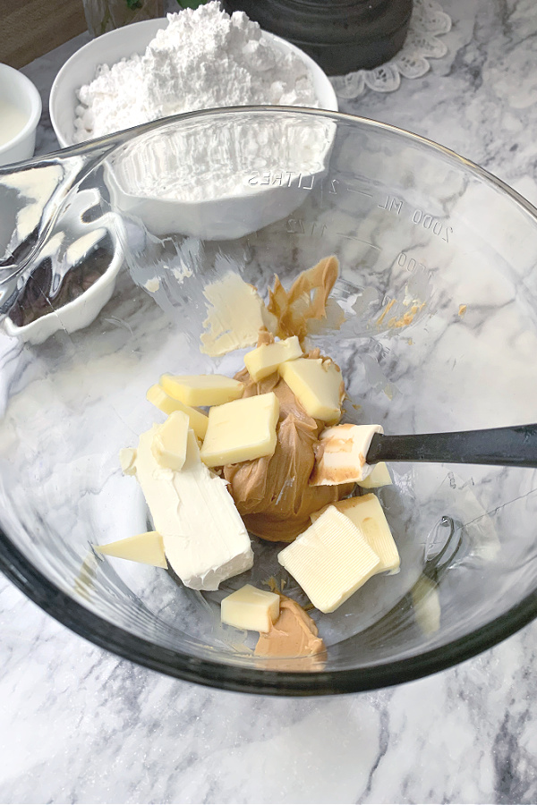 butter and peanut butter ingredients for making recipe for Peanut Butter Frosted Brownies.