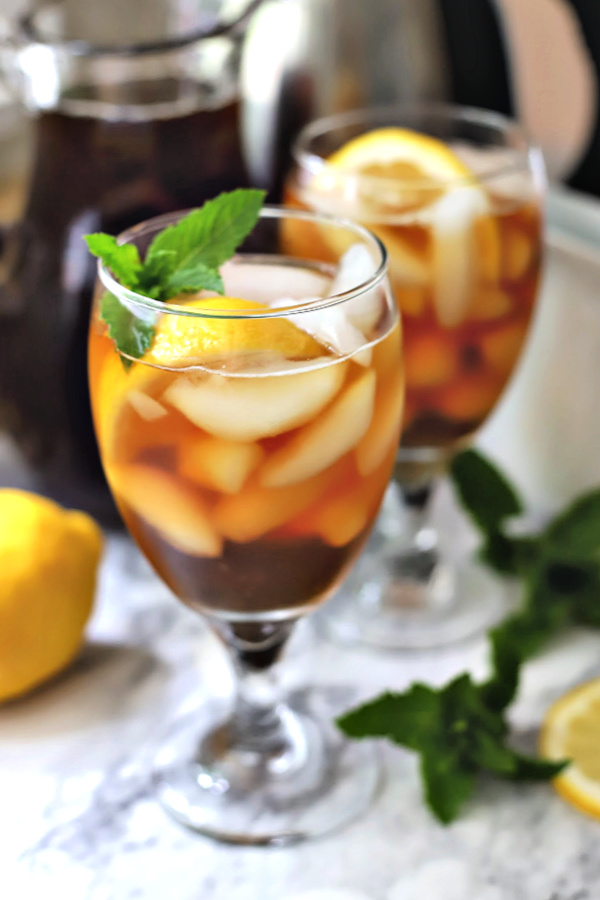 Easy how-to recipe for making brewed iced tea. Steep tea bags, add sugar or leave unsweetened, add a squeeze of fresh lemon or orange juice and a sprig of mint. Serve chilled over ice for a refreshing beverage.