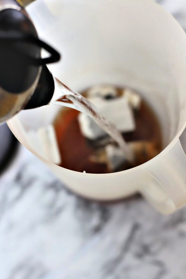 Easy how-to for fresh brewed iced tea sweetened or without sugar. Homemade recipe using tea bags with a squeeze of lemon or orange juice and a sprig of mint.