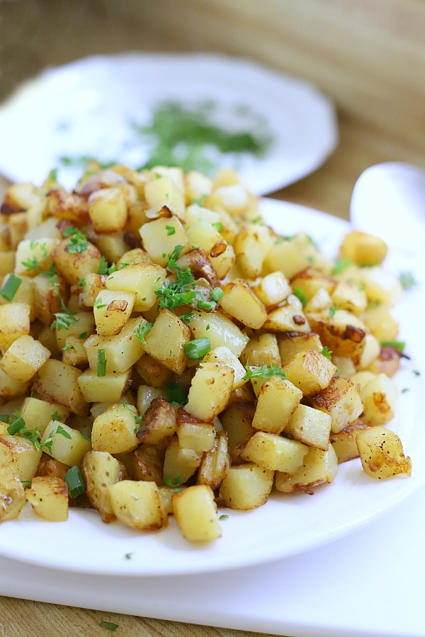 Easy recipe for homemade hashed browns. Diced potatoes are cooked in butter to perfection with a crispy exterior and great potato flavor. Great with eggs and bacon for breakfast or as a dinner side dish.