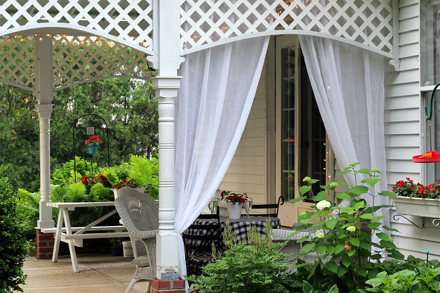 Create an inviting ambiance for dining and entertaining with an easy up-cycling DIY. Re-purposed Curtains for the Patio look lovely and romantic.