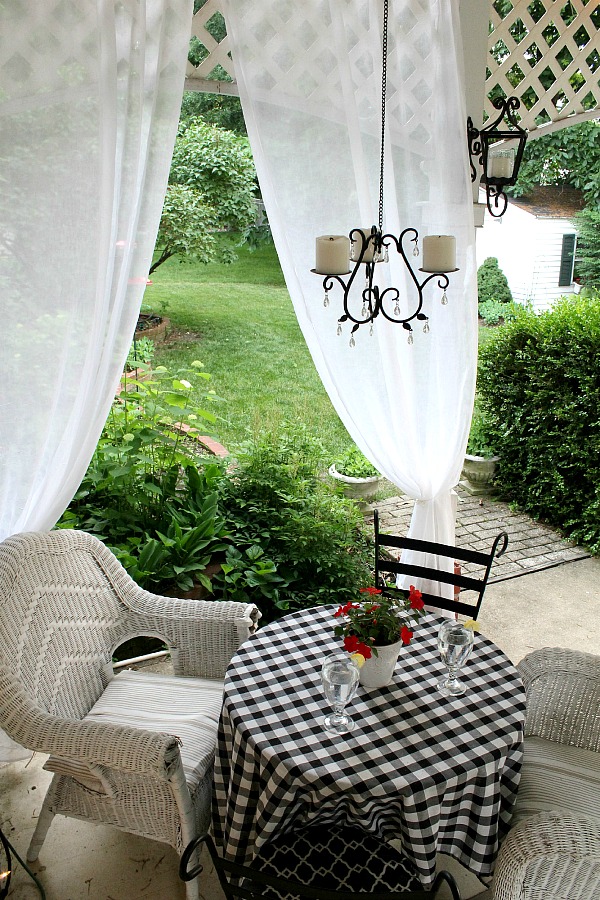 Create an inviting ambiance for dining and entertaining with an easy up-cycling DIY. Re-purposed Curtains for the Patio look lovely and romantic.