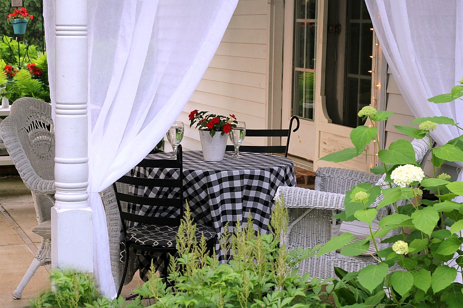 Create an inviting ambiance for dining and entertaining with an easy up-cycling DIY. Re-purposed Curtains for the Patio look lovely and romantic.