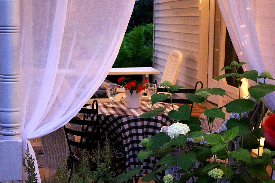 Create an inviting ambiance for dining and entertaining with an easy up-cycling DIY. Re-purposed Curtains for the Patio look lovely and romantic.