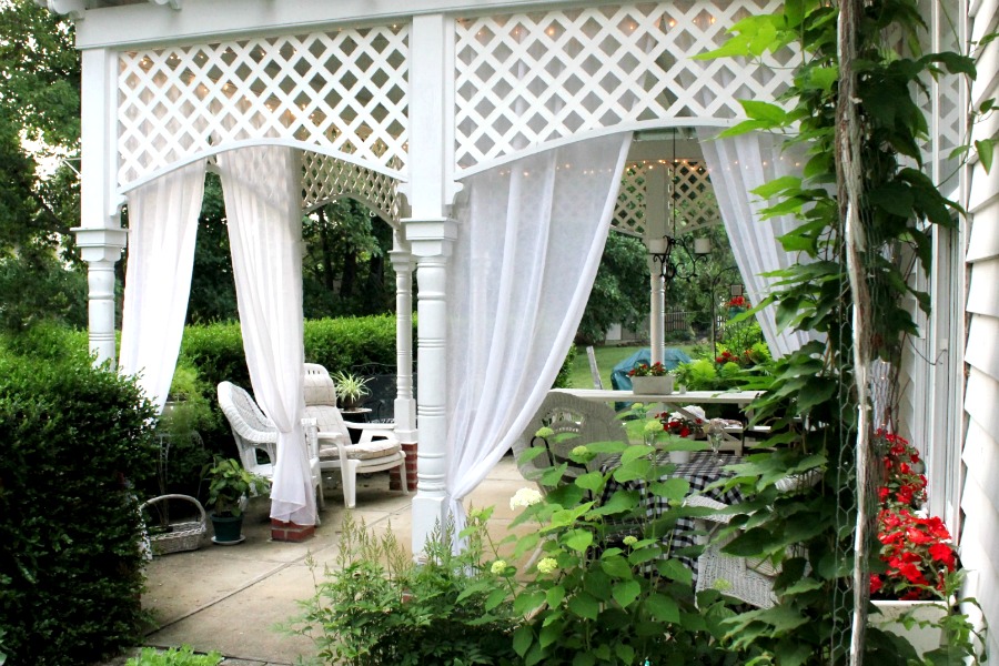 Create an inviting ambiance for dining and entertaining with an easy up-cycling DIY. Re-purposed Curtains for the Patio look lovely and romantic.