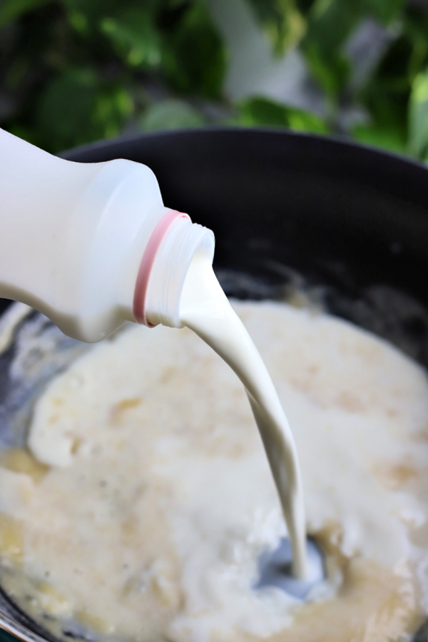 adding milk to roux for homemade baked macaroni and cheese