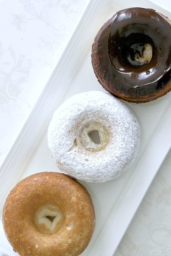 Debate remains as to how to spell these circular wonders of dough with the hole in the center. Spell "donut" or "doughnut", there is no debate about enjoying homemade, baked donuts. The only decision is whether to choose frosted, rolled in cinnamon sugar, confectioners' sugar or a perfectly plain doughnut. Skip the frying with this easy baked version.