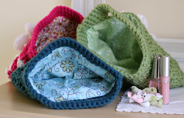 Easy pattern for adorable crochet boutique bags. Great size as a clutch to hold cell phone & wallet or as a cosmetic bag. Cute for little girls too.