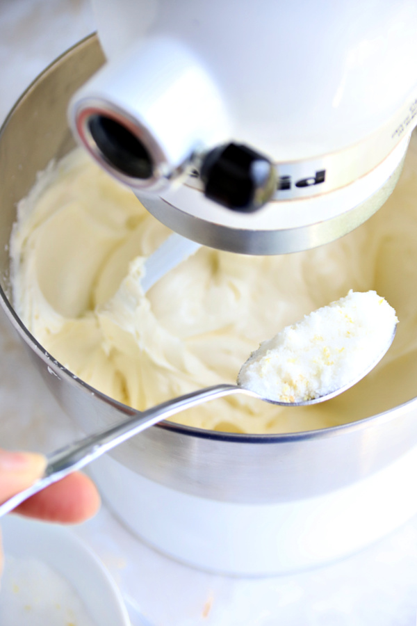 Making the batter for triple lemon cheesecake dessert.