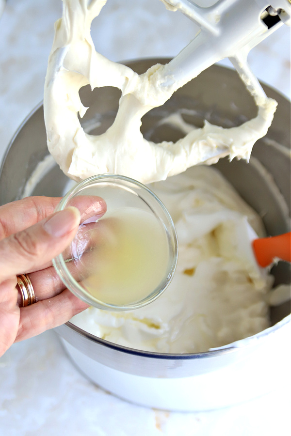 Making the batter for triple lemon cheesecake dessert.