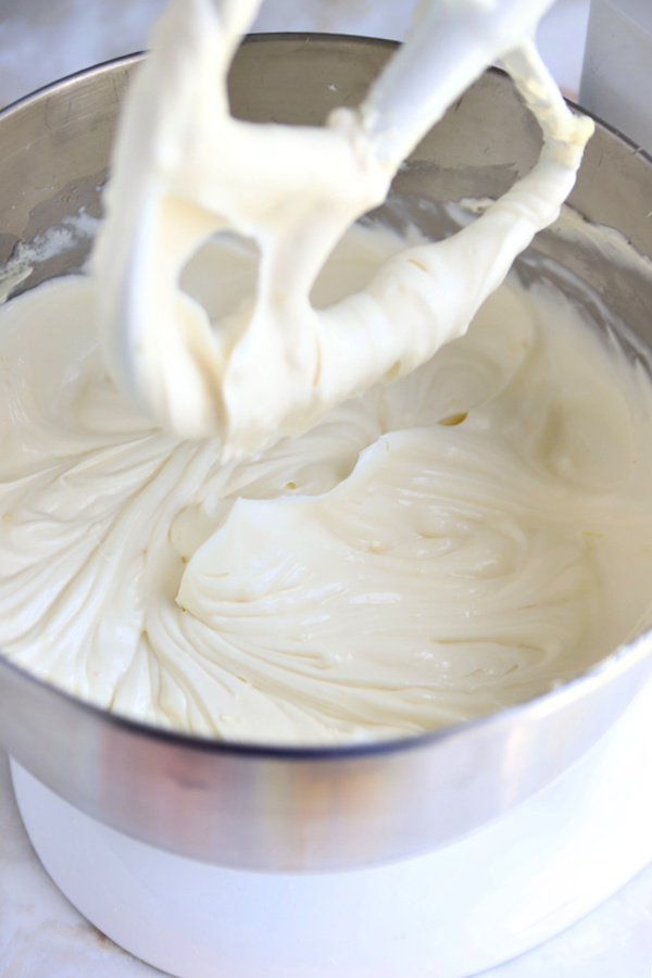 Making the batter for triple lemon cheesecake dessert.