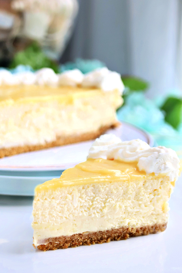 The best Philadelphia cream cheese cheesecake recipe with homemade lemon curd topping.