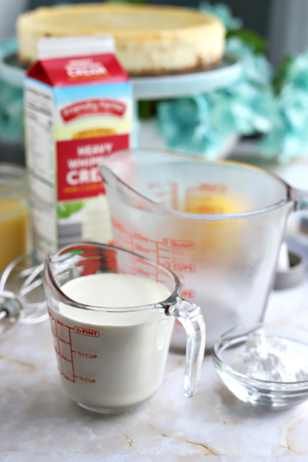 Ingredients for making homemade whipped cream for triple lemon cheesecake.