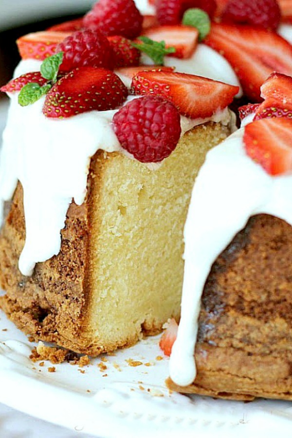 Cream Cheese Pound Cake is a showstopper dessert that is moist and delicious. Serve plain or dress it up with snowy white frosting and top with strawberries.