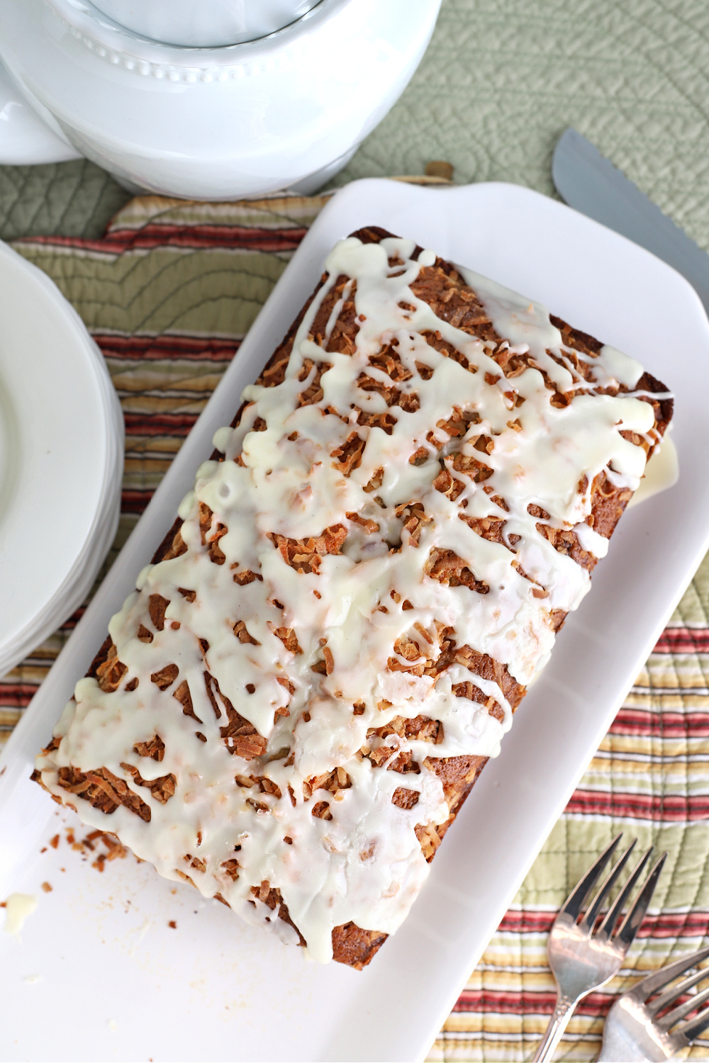 Citrus glazed coconut banana quick bread ready to serve.