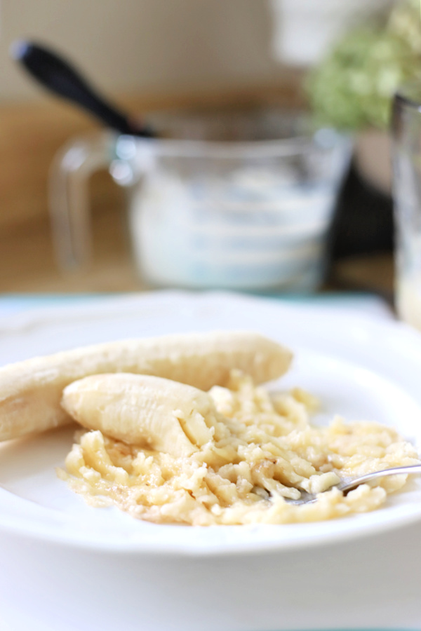 Mashing bananas for coconut banana quick bread.