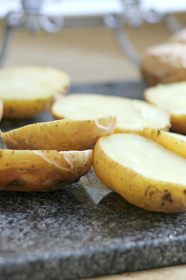 Oven crisped Potato skins make an easy and delicious appetizer. Baked until crisp and loaded with bacon, cheese, green onions or sour cream.