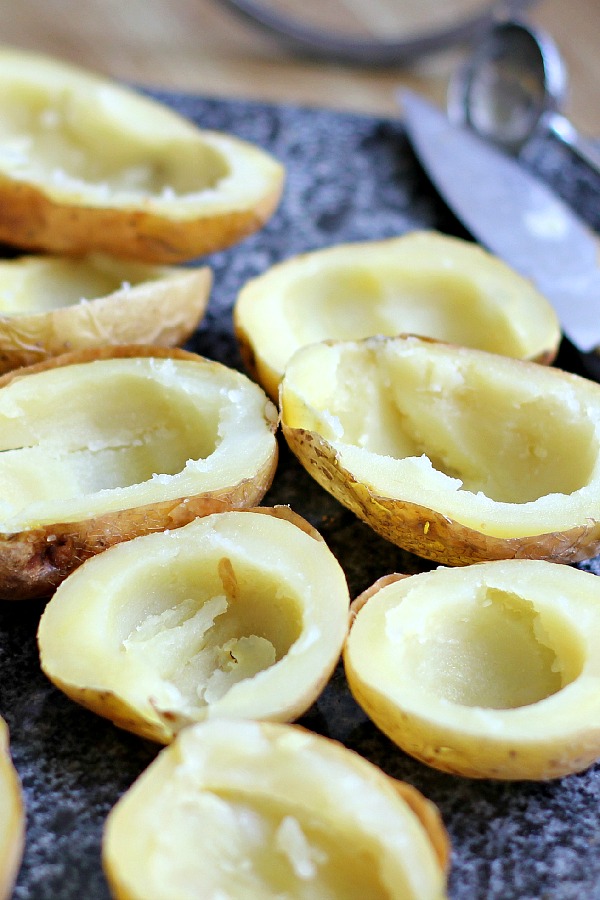 Oven crisped Potato skins make an easy and delicious appetizer. Baked until crisp and loaded with bacon, cheese, green onions or sour cream.