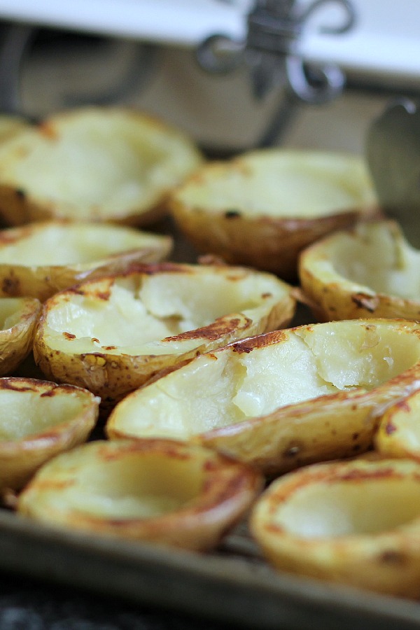 Oven crisped Potato skins make an easy and delicious appetizer. Baked until crisp and loaded with bacon, cheese, green onions or sour cream.